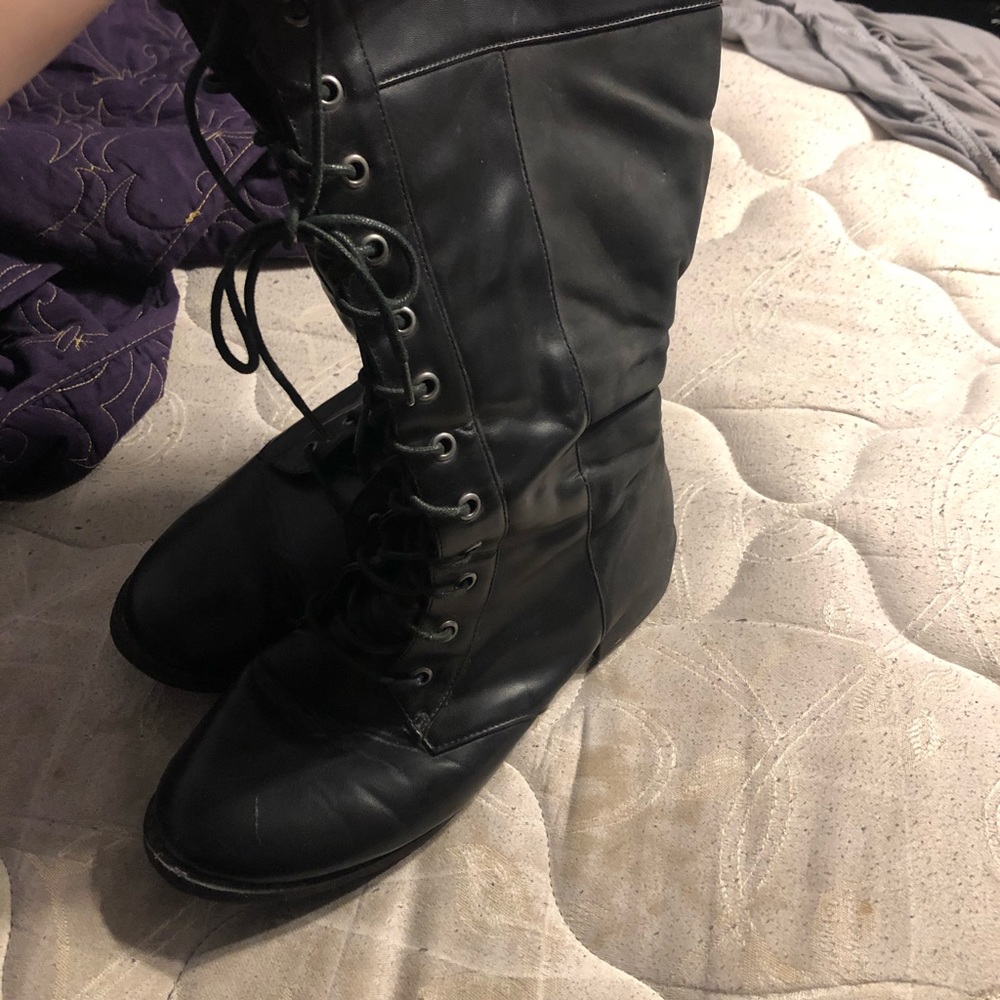 Knee high torrid combat boots.